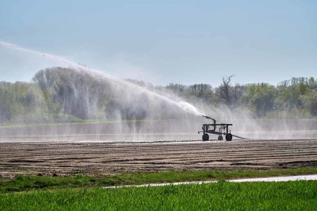 Implement sprinkler irrigation system to Improve Agriculture Production
