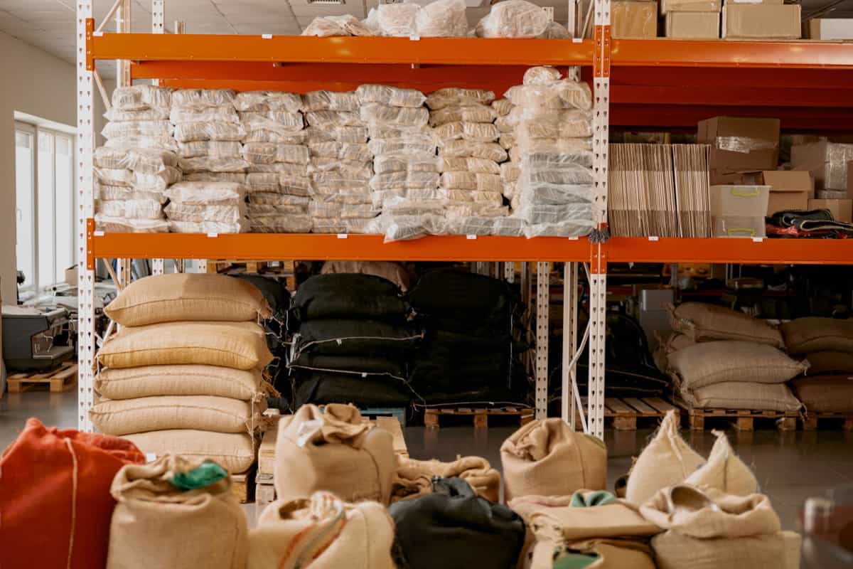 Warehouse of a small coffee factory with shelves and bags